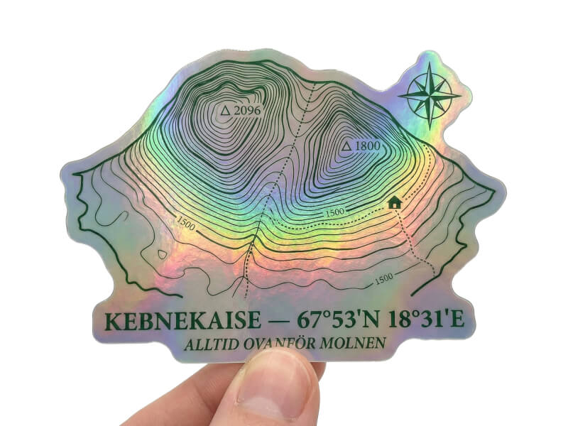 Stansad klistermärke i hologram med regnbågsskimrande yta på vit bakgrund